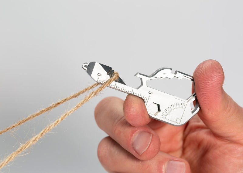 Geekey Keychain Multitool UK being used as cutting tool