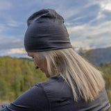 front view action shot of the Jerven Merino wool beanie in phantom grey