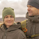 The Jerven Merino Wool Beanie in cypress green and Phantom Grey being worn by  a couple.