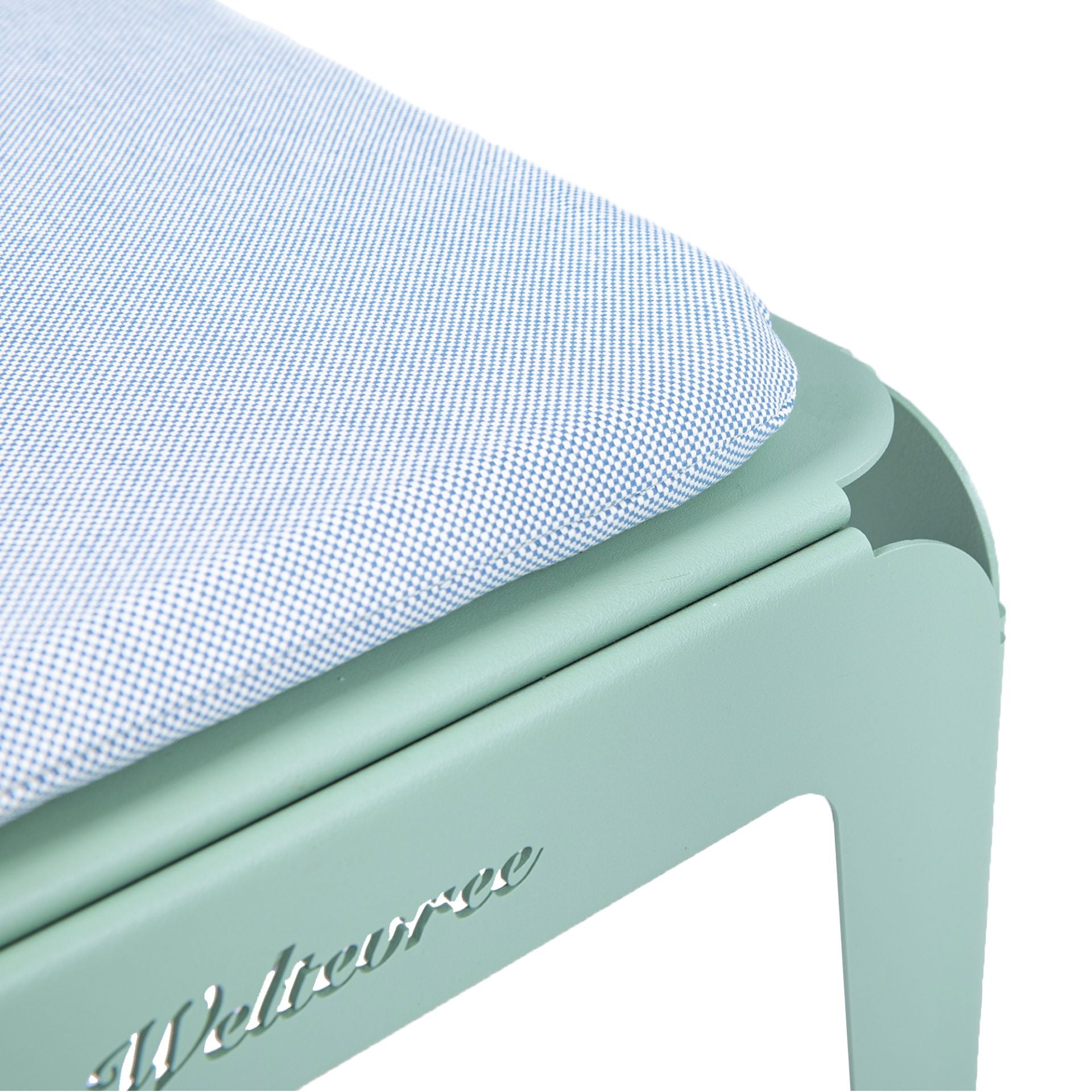 Close up of cushion on bended bench