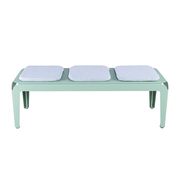 Cushion set of 3 on green bended bench